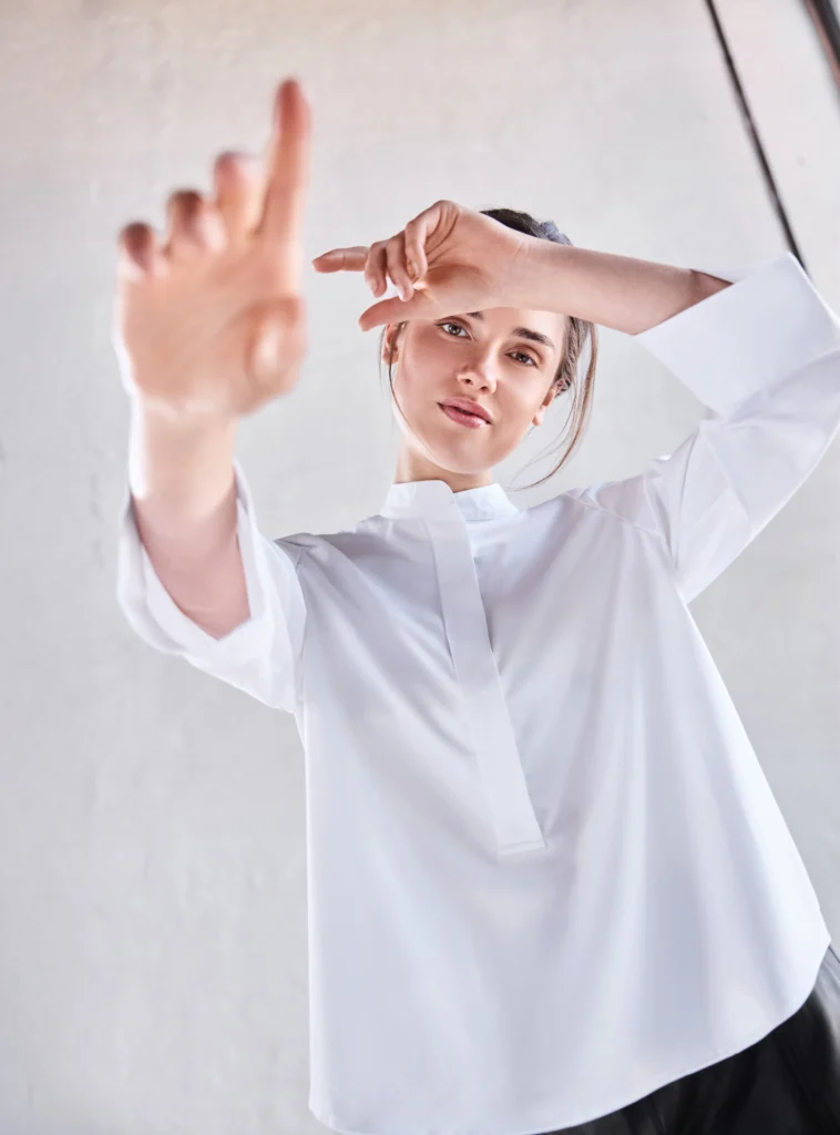 Woman in white, bamboo BTF-CPH shirt